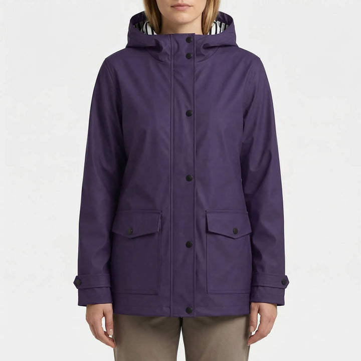 Essential women's fall jacket: hooded, waterproof, and lightweight for changing weather on outdoor trails.