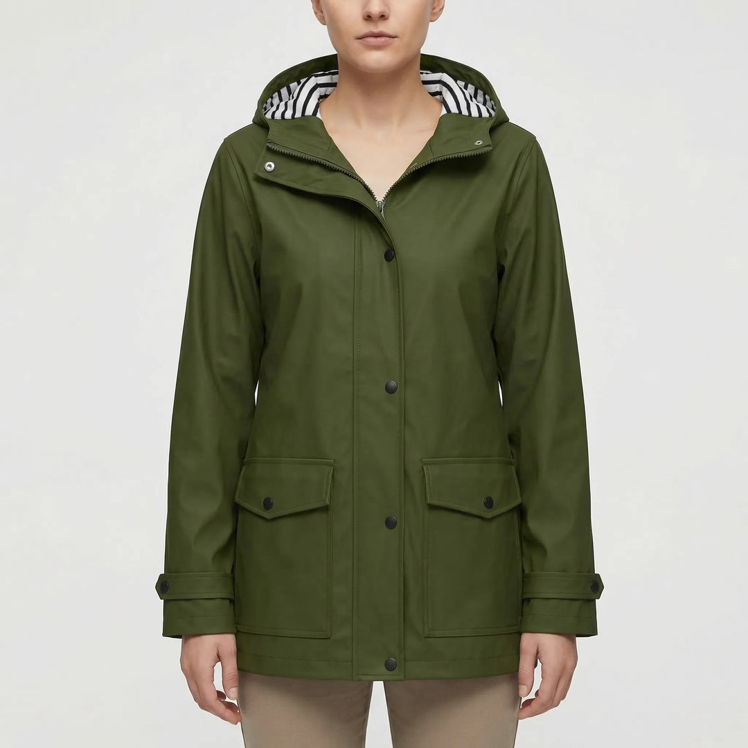 Side profile of a woman wearing a fitted, lightweight waterproof jacket, perfect for active outdoor use.