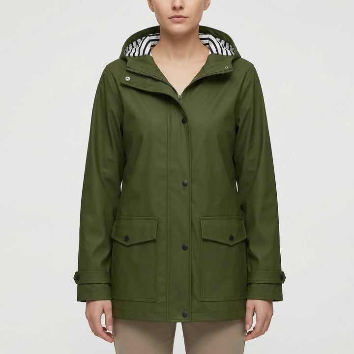 Side profile of a woman wearing a fitted, lightweight waterproof jacket, perfect for active outdoor use.