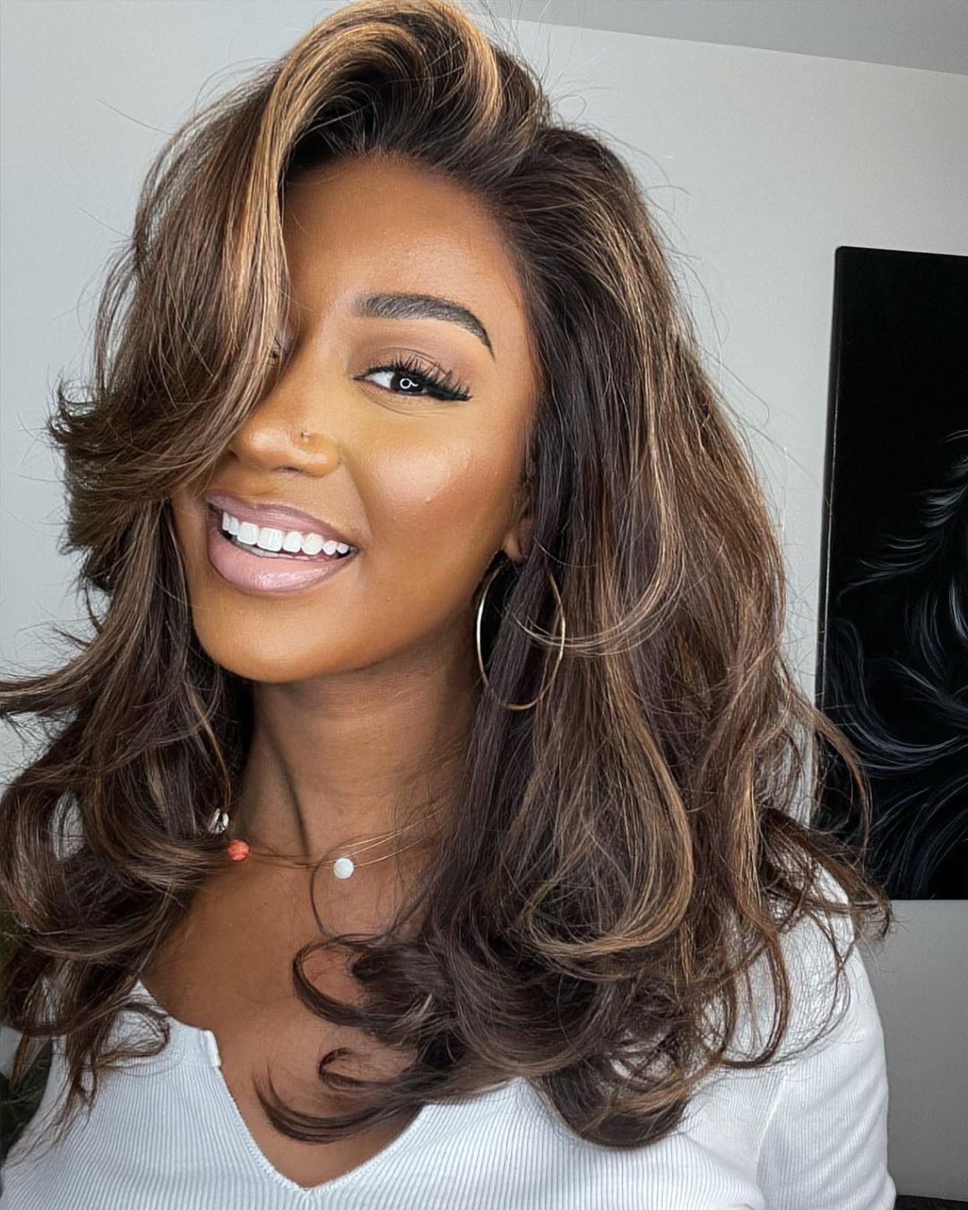 Women's human hair lace front wig, natural blonde highlights, soft waves, realistic look for women.