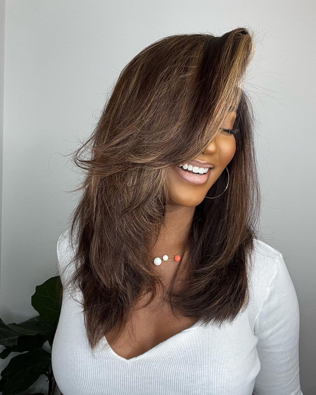 Wavy human hair lace front wig for women with deep part, natural blonde highlights & premium quality.