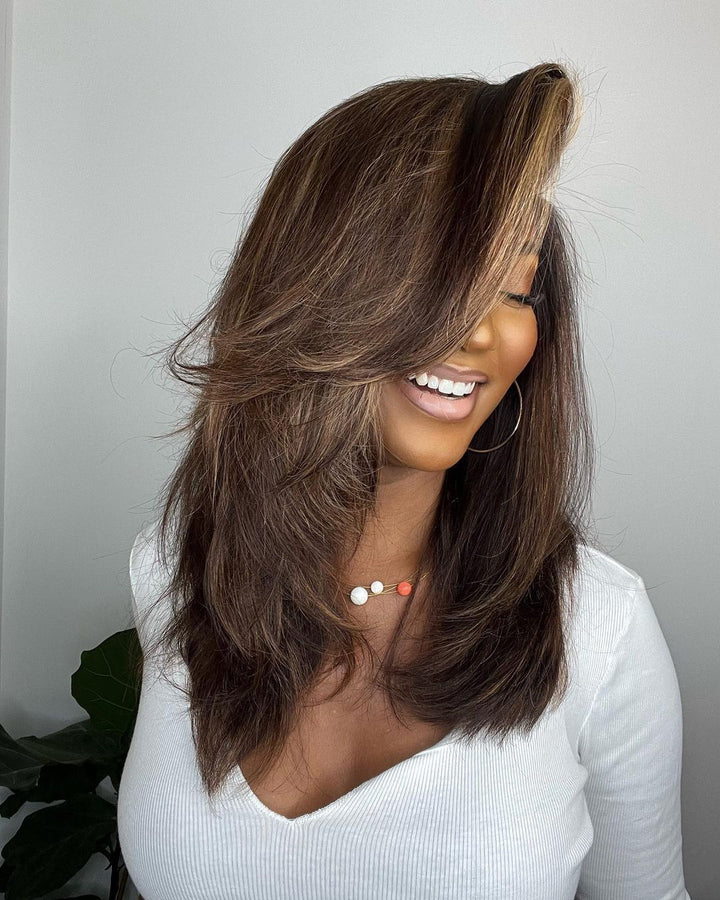 Wavy human hair lace front wig for women with deep part, natural blonde highlights & premium quality.