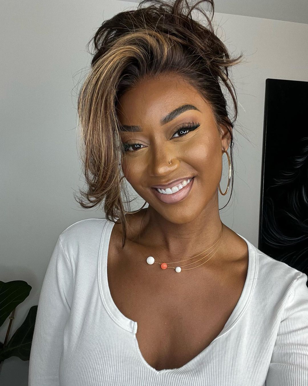 Beautiful human hair wig, lace front with natural blonde highlights & flowing wavy texture for women.