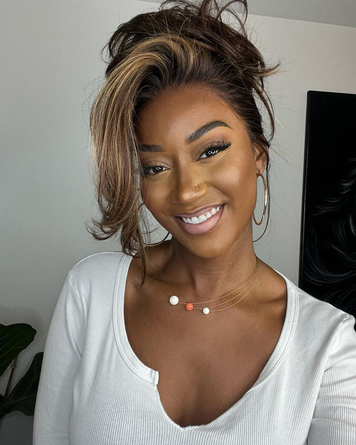 Beautiful human hair wig, lace front with natural blonde highlights & flowing wavy texture for women.