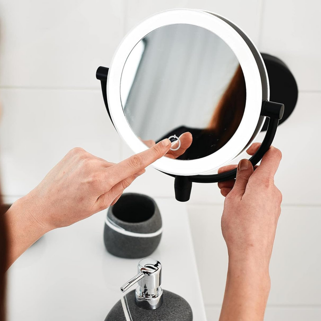 Portable illuminated mirror featuring 3x magnification, ideal for travel and daily beauty.