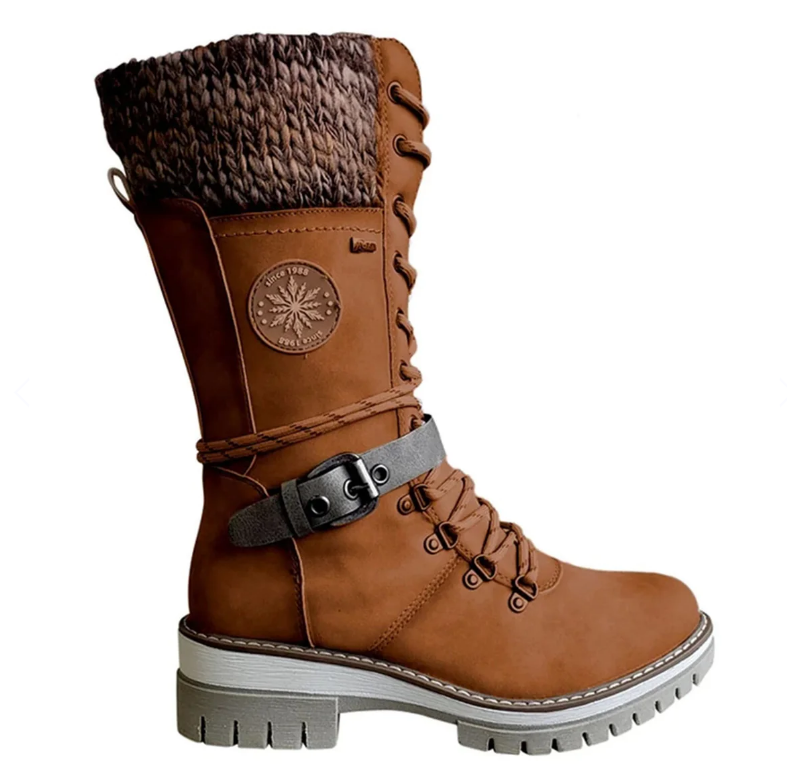 Stylish women's insulated boots, ideal for cold weather, waterproof and comfy footwear.