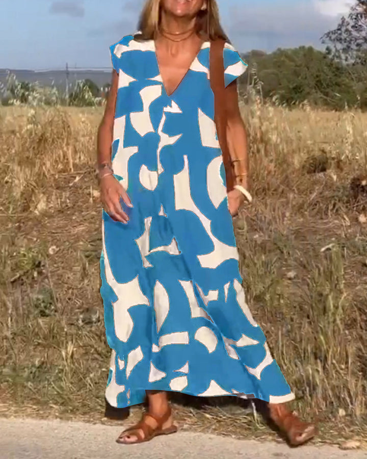Ladies' casual abstract print dress, cap sleeve V-neck, great for everyday summer style.