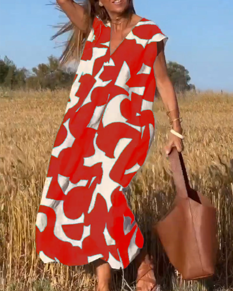 Abstract printed V-neck dress for women, cap sleeve design, ideal for casual everyday wear.