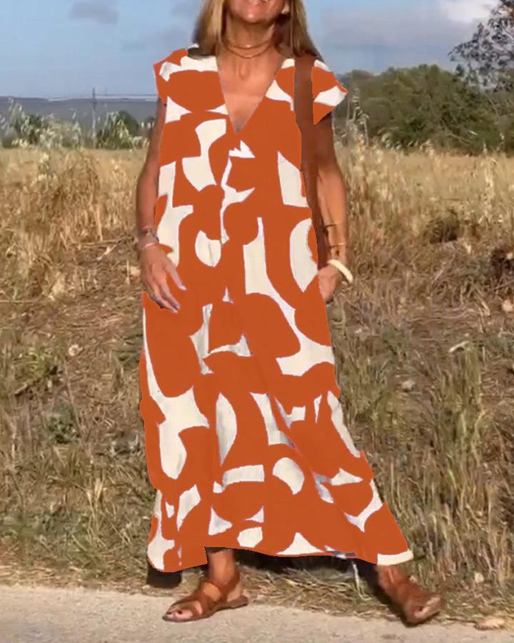 Versatile women's abstract dress, V-neck, cap sleeve, relaxed fit, perfect for vacation.