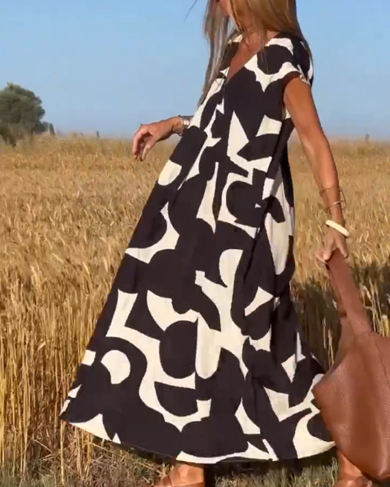 Casual women's abstract print dress with a relaxed fit, ideal for everyday summer fashion.
