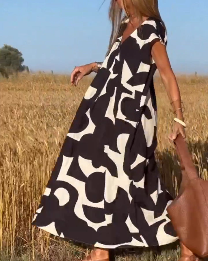 Casual women's abstract print dress with a relaxed fit, ideal for everyday summer fashion.