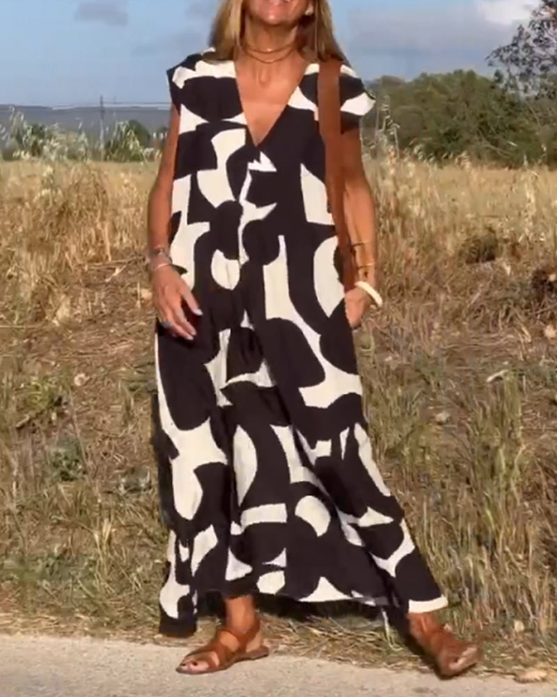 V-neck abstract print dress, a casual women's fashion staple for summer and vacation.