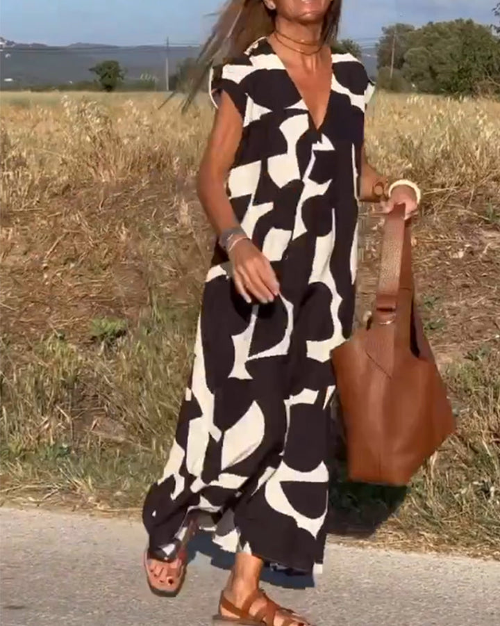 Kendall relaxed fit summer dress with an abstract print, ideal for ladies' casual style.