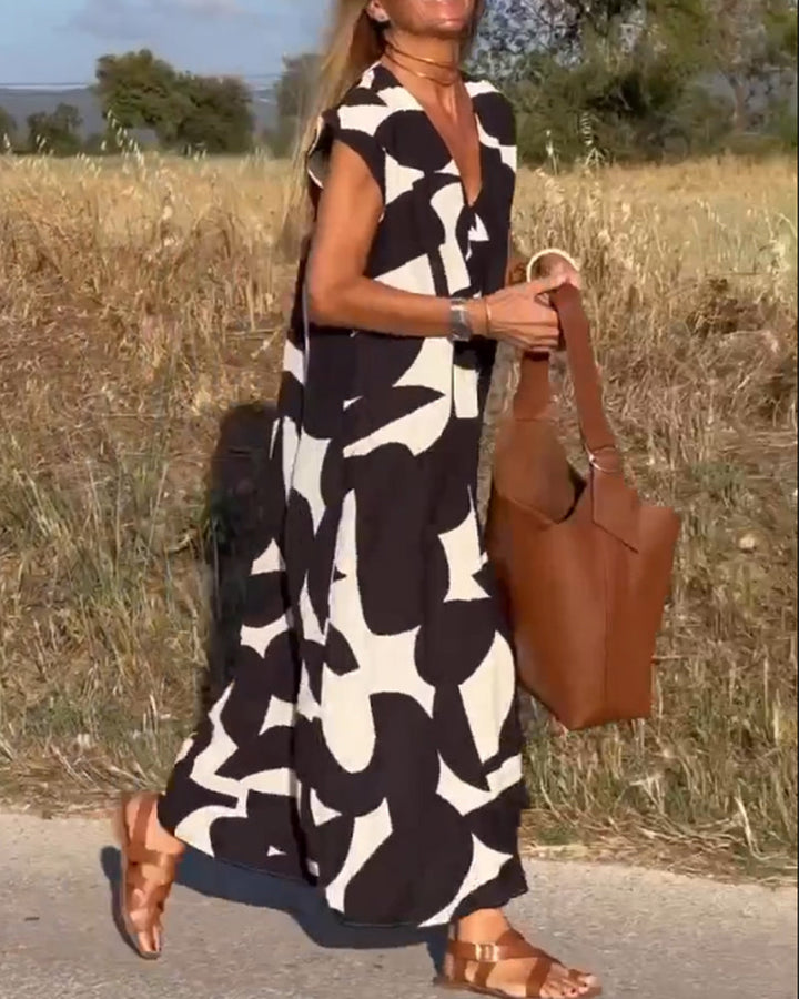 Everyday wear women's abstract printed dress, comfortable relaxed fit with cap sleeves.