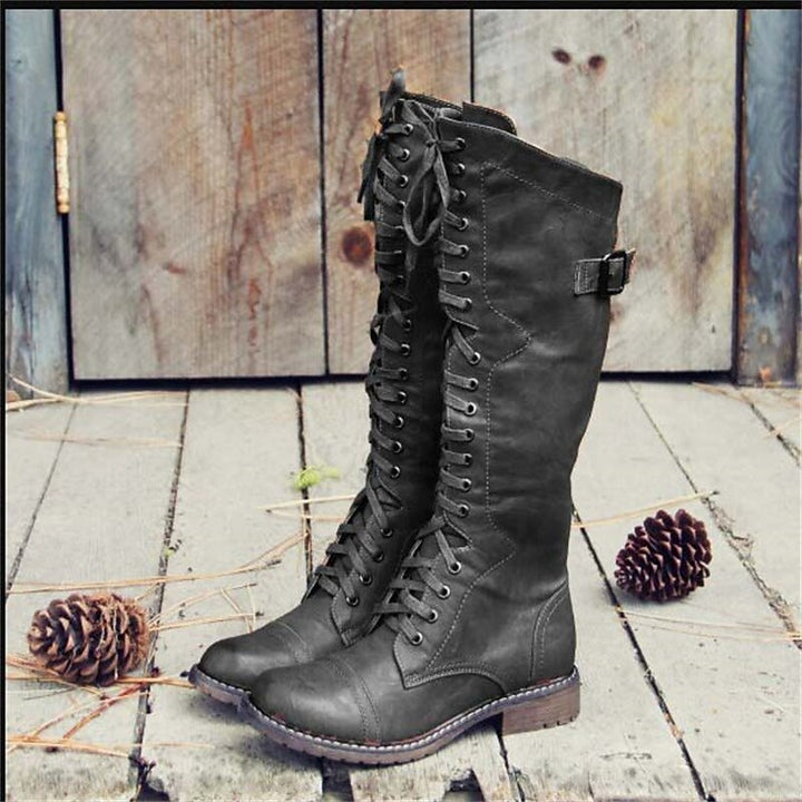 Comfortable women's knee-high riding boots featuring a full lace-up design, ideal for casual everyday style.