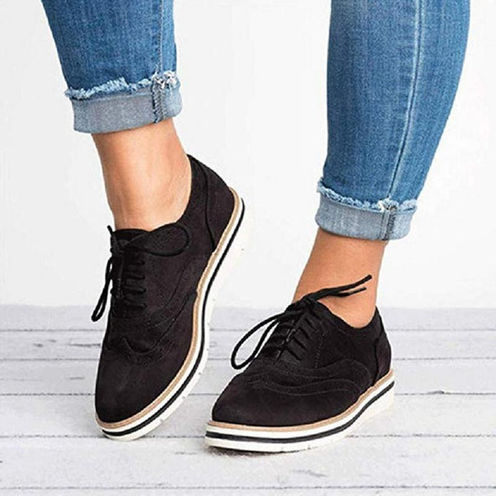Stylish Grey Women's Lace-Up Oxford Sneakers with brogue details. Ideal for comfortable everyday and smart-casual looks.