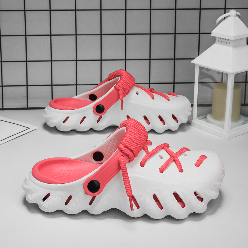 Slip-on women's comfort clogs, featuring durable material and adjustable laces.