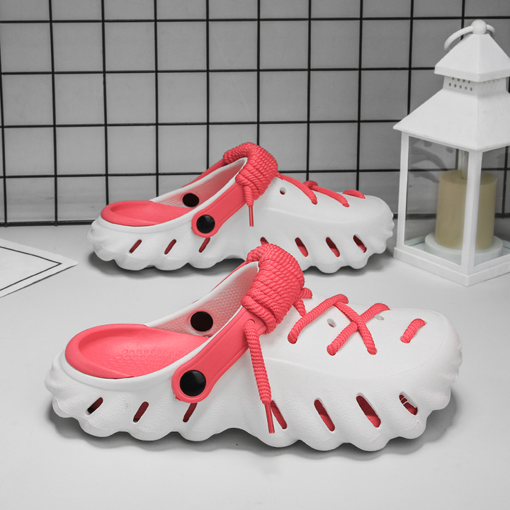 Slip-on women's comfort clogs, featuring durable material and adjustable laces.