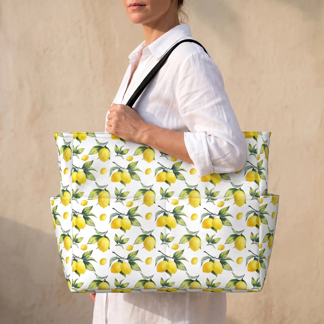 Women's large beach tote bag with vibrant tropical lemon print, perfect for summer vacations.