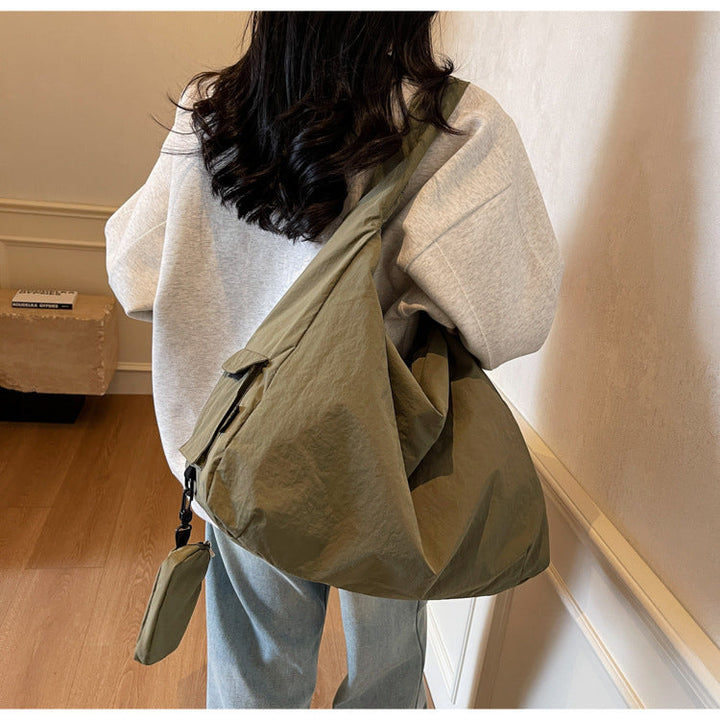 Women's large capacity slouchy crossbody bag for everyday essentials.