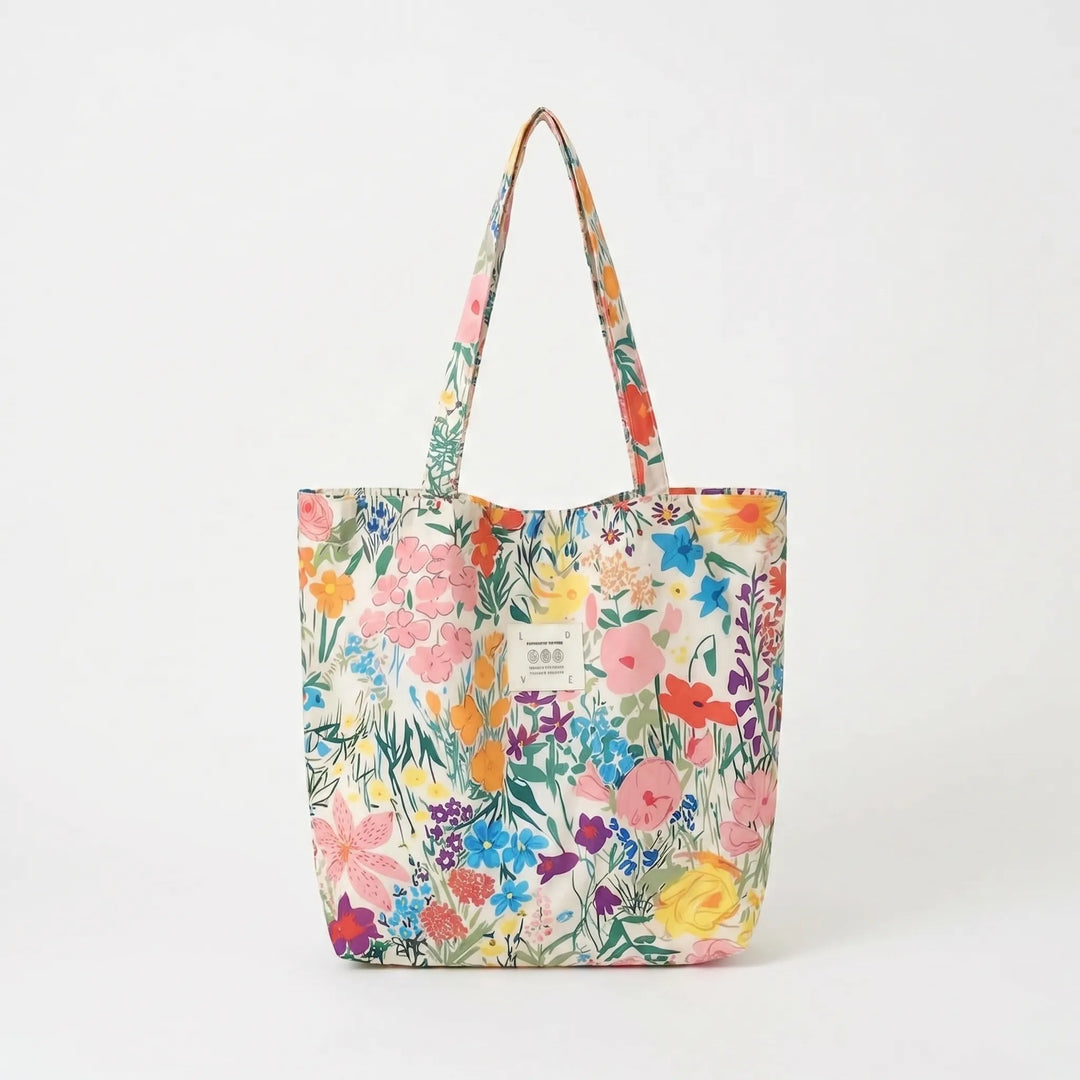 Chic women's floral print shoulder tote bag, a trendy fashion accessory for any outfit.