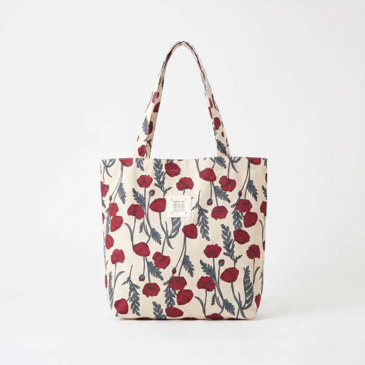 Spacious women's floral print tote bag with comfortable shoulder strap, ideal for summer travel.