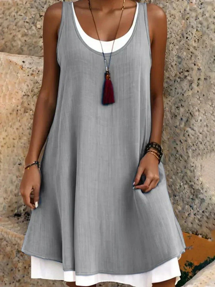 Casual women's sleeveless layered mini dress, ideal for daily wear, vacation, or a comfortable summer outing.