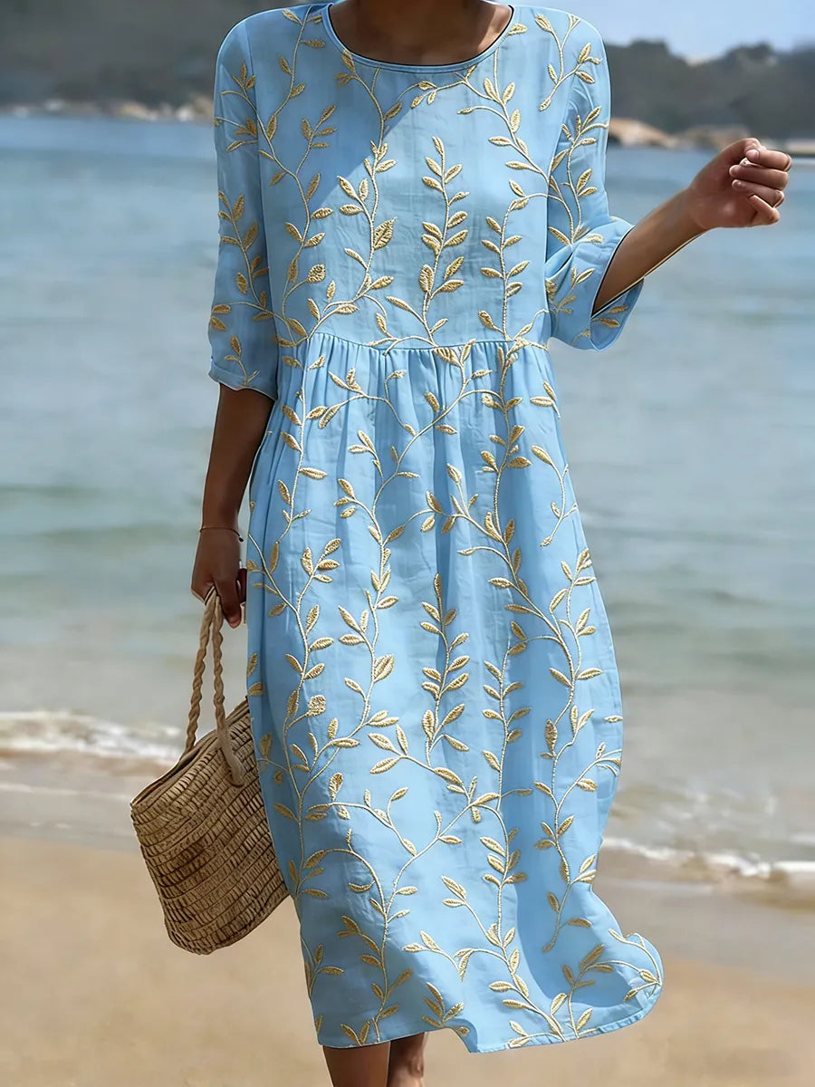 Women's leaf embroidered midi dress with three-quarter sleeves, a flowy botanical smock for summer vacation.
