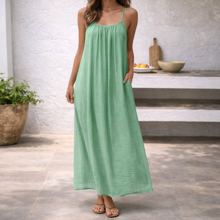 Vacation-ready Women's Lena Spaghetti Strap Maxi Sundress. A comfortable and flowing beach dress.