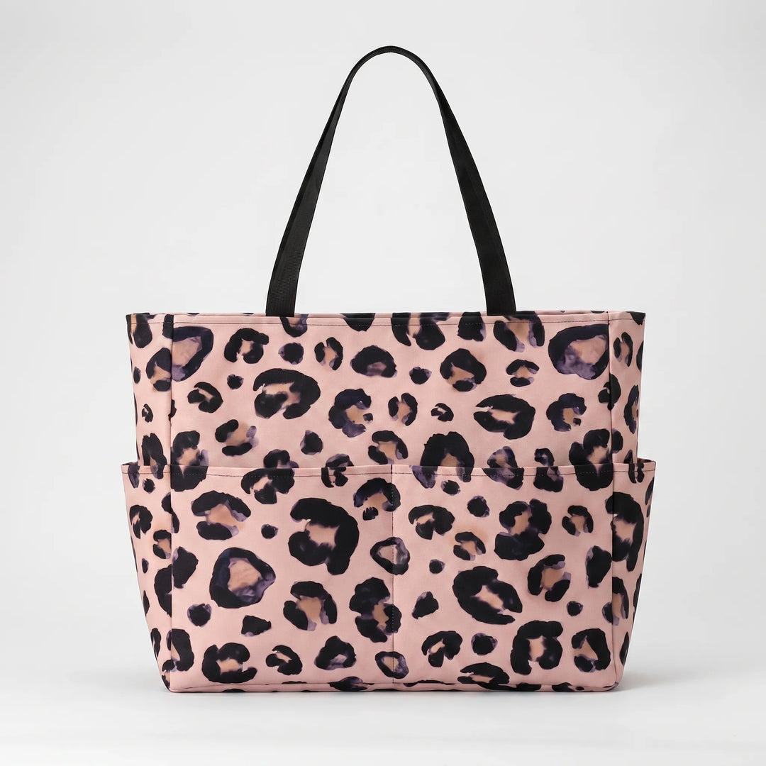 Stylish women's leopard print beach bag, large capacity shoulder tote, ideal for travel.