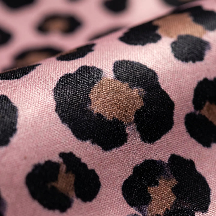 Spacious leopard print tote bag for women, trendy beach & travel accessory.