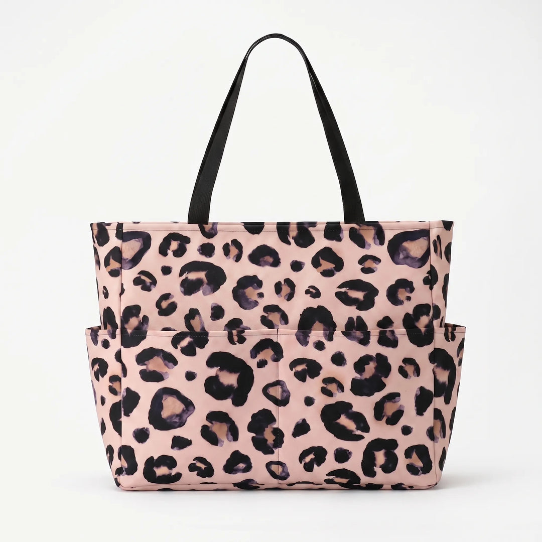 Water-resistant leopard print beach tote bag for women, stylish large capacity travel.