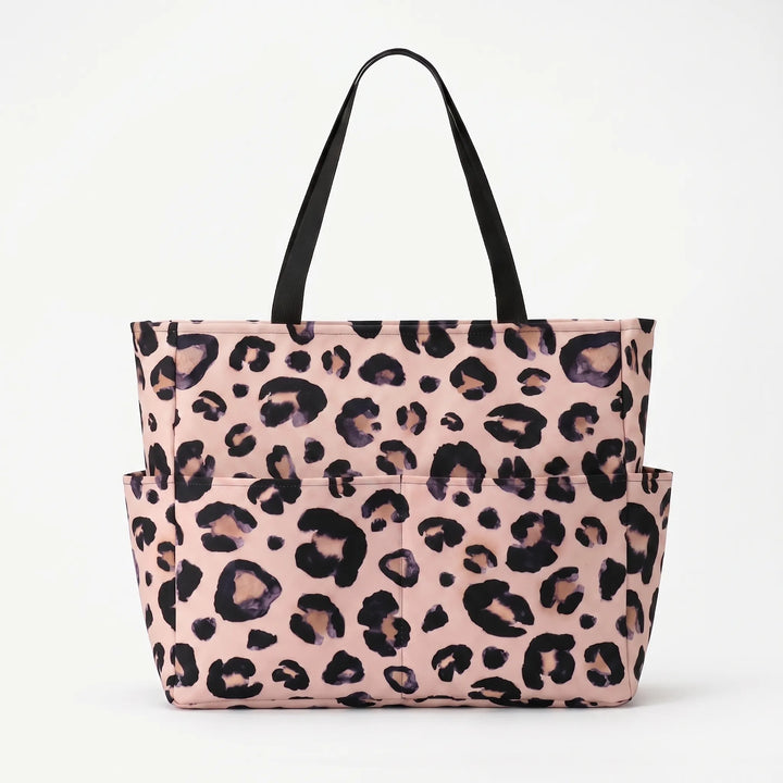 Water-resistant leopard print beach tote bag for women, stylish large capacity travel.