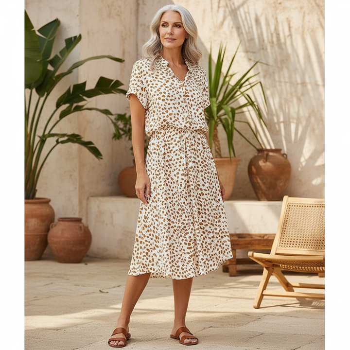 Women's leopard print button-down belted midi dress. Chic summer fashion, perfect for casual day or vacation wear.