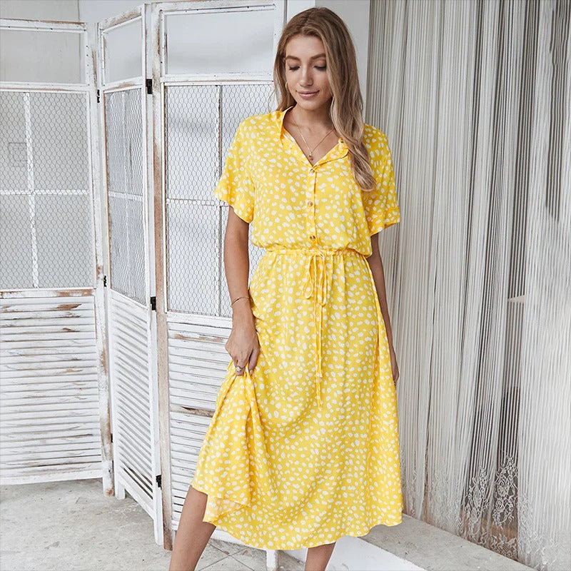 Casual women's leopard print button-down midi dress with belt. Perfect day dress for summer or vacation fashion.