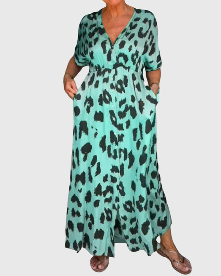 Versatile women's leopard print V-neck maxi dress with elastic waist. Button front detail, ideal for casual or evening wear.