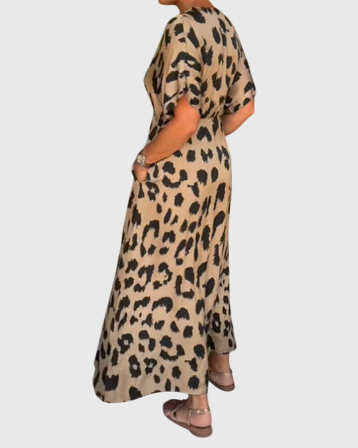 Stylish women's leopard print V-neck maxi dress with elastic waist. Button front, perfect for summer, beach, or casual events.