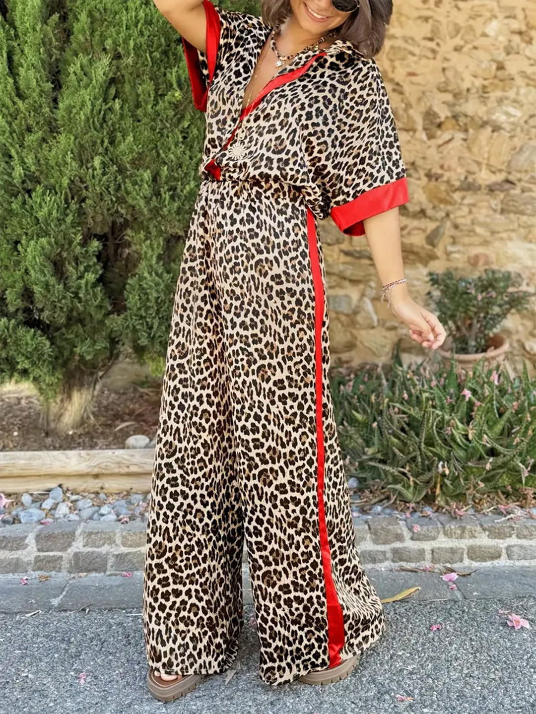 Leopard print women's wide leg jumpsuit featuring a flattering v-neck. Perfect for casual chic.