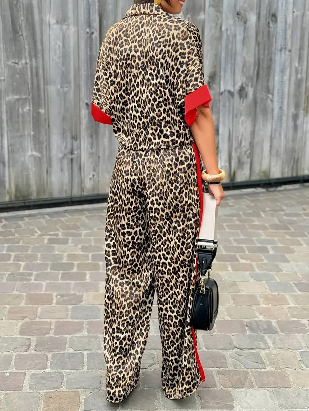 Stylish animal print wide leg jumpsuit for women. V-neck design, ideal for spring & summer vacation.