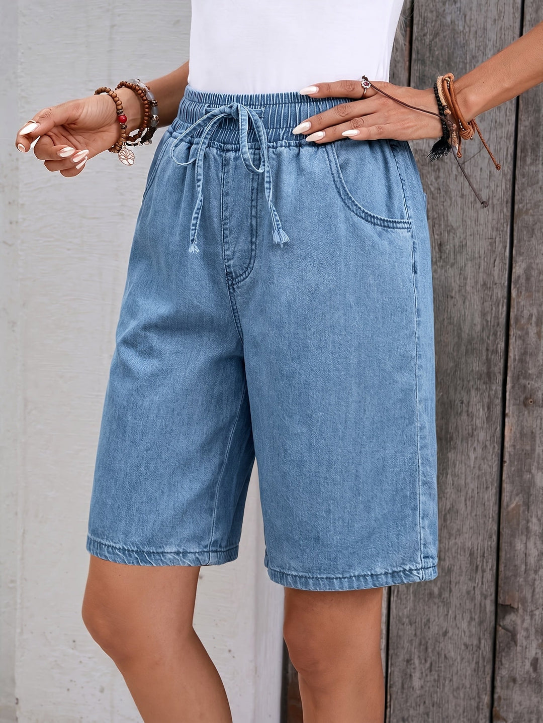 Casual light blue women's Bermuda shorts, ideal for summer fashion with an elastic drawstring waist.