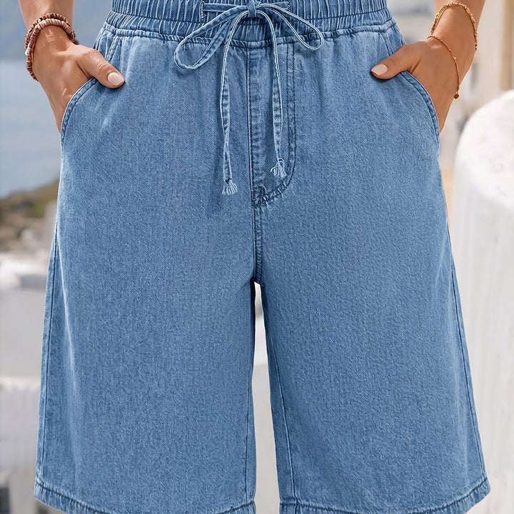 Detail shot of the elastic drawstring waist on light blue women's Bermuda shorts for casual style.