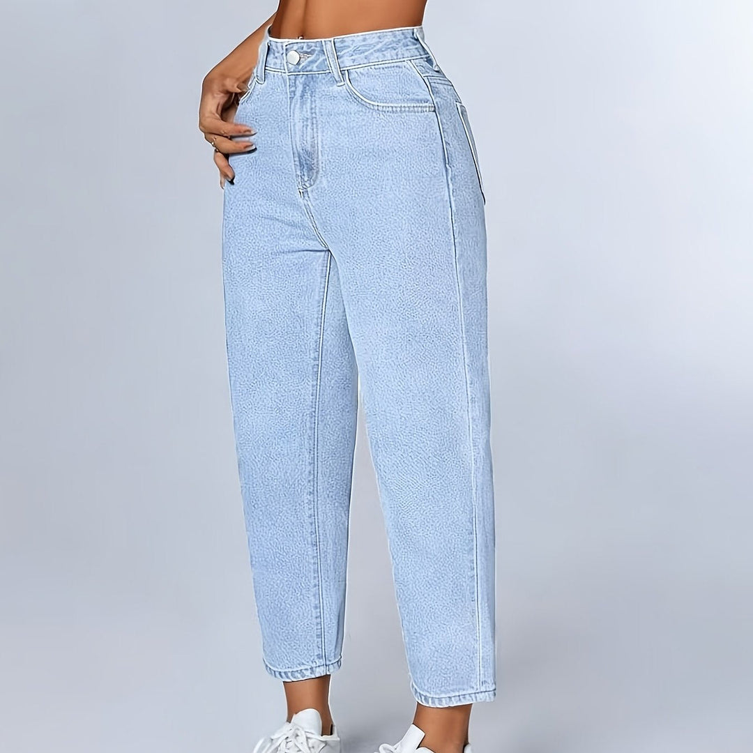 Stylish women's light blue mom jeans, high waist, relaxed fit, tapered leg, perfect for versatile casual outfits.