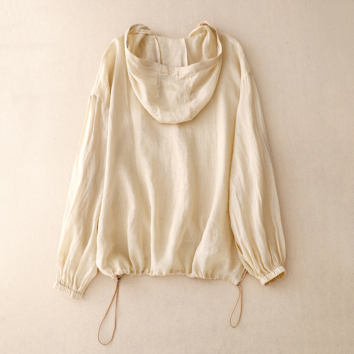 Chic women's airy pullover hoodie, perfect for casual spring outfits or comfortable summer fashion. Features button front.