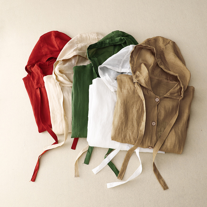 Versatile women's airy pullover hoodie. Lightweight, relaxed fit, button front, and balloon sleeves for casual chic.
