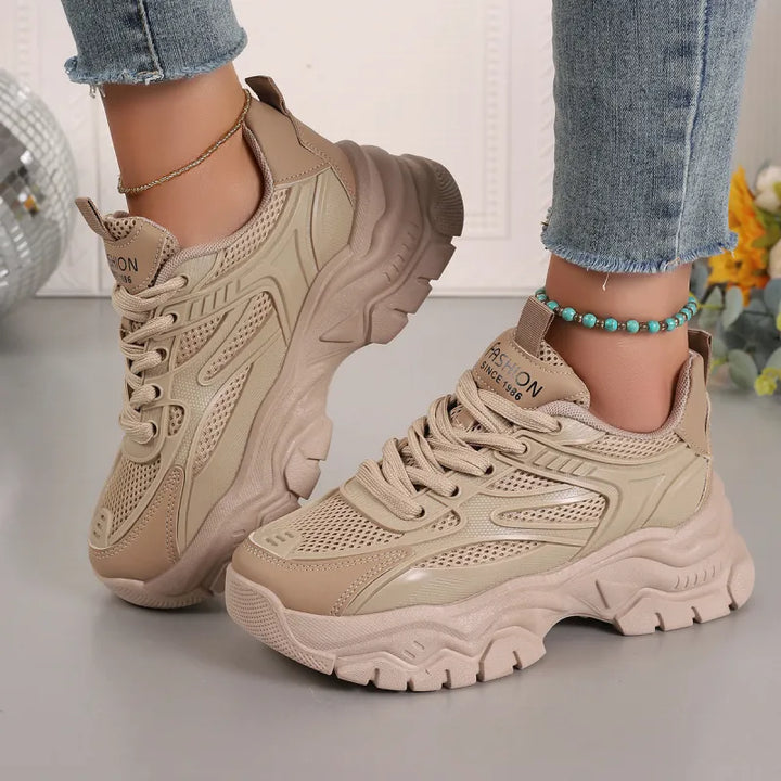 Chunky platform sole women's fashion sneakers, providing a stylish and comfortable fit for walking.