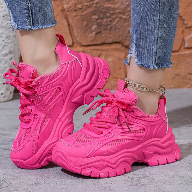 Pink chunky platform women's fashion sneakers, offering a trendy look and comfortable support for walking.