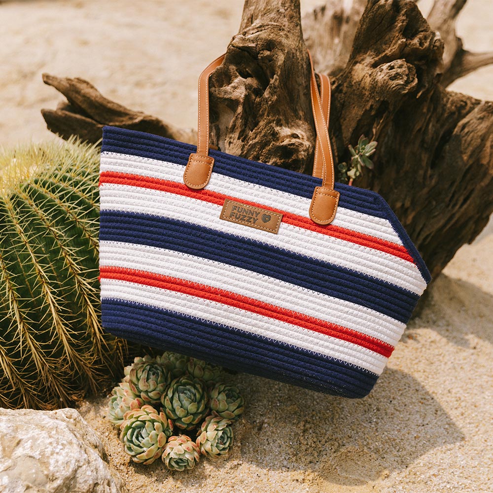 Women's lightweight cotton woven pet carrier beach bag folded, showing its compact and travel-friendly nature.