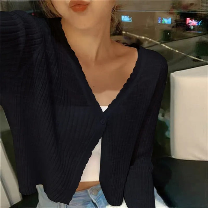 Textured view of women's cropped button cardigan, lightweight & comfortable for casual or everyday wear.