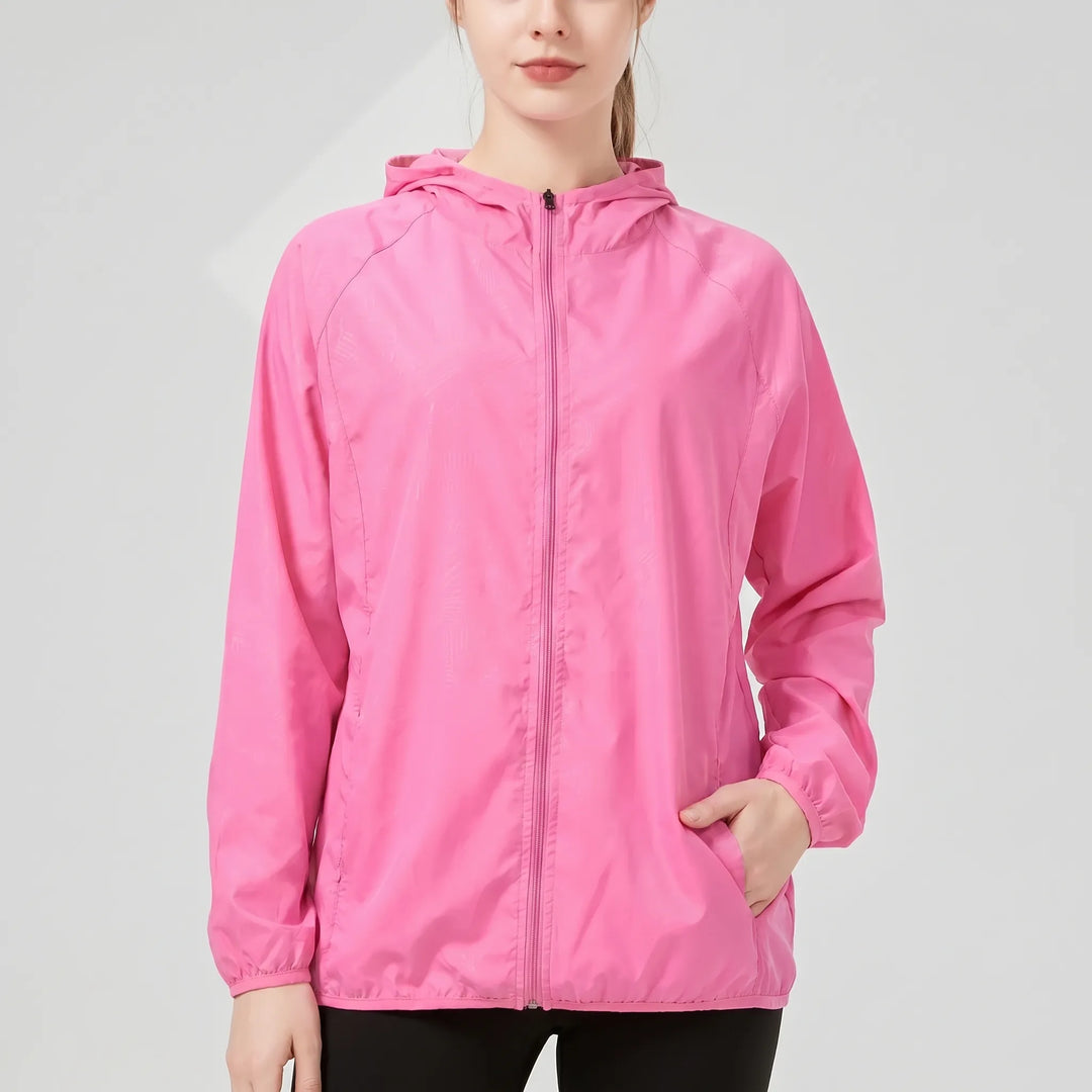 Packable women's lightweight hooded travel jacket. Ideal for activewear, outdoor sports, and easy carrying.
