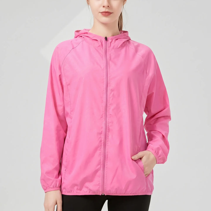 Packable women's lightweight hooded travel jacket. Ideal for activewear, outdoor sports, and easy carrying.